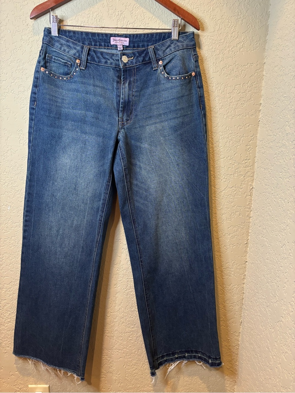 Juicy Couture blue denim jeans with rhinestone logo on back